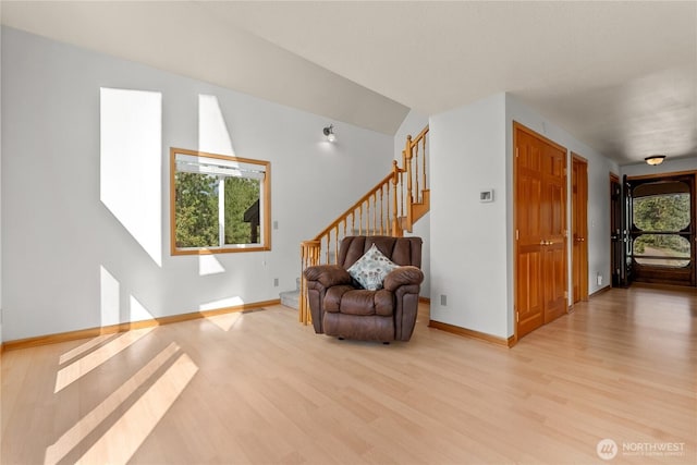 11 Appaloosa Rd, Winthrop, WA 98862 - living area with light wood-type flooring, stairs, and baseboards