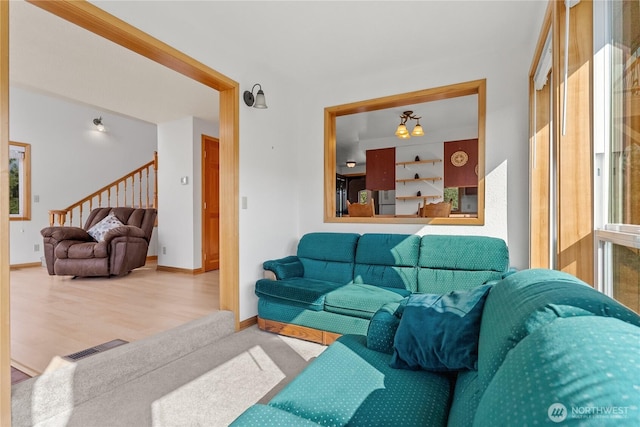 11 Appaloosa Rd, Winthrop, WA 98862 - living room featuring stairway, wood finished floors, and baseboards