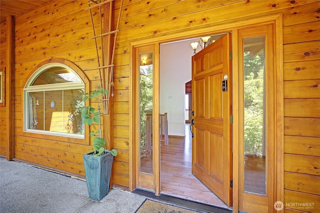 1051 Lightning Way, Camano Island, WA 98282 - foyer with wood walls and carpet floors