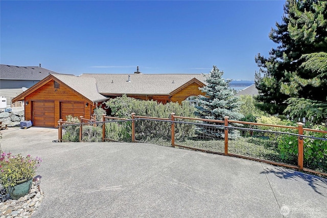 1051 Lightning Way, Camano Island, WA 98282 - view of patio featuring an attached garage and concrete driveway