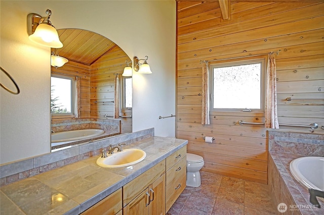 1051 Lightning Way, Camano Island, WA 98282 - full bathroom with wood ceiling, lofted ceiling, a garden tub, vanity, and wood walls