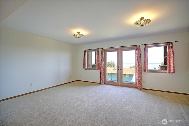 1051 Lightning Way, Camano Island, WA 98282 - unfurnished room featuring baseboards, light colored carpet, and healthy amount of natural light