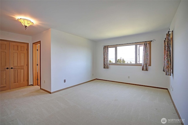 1051 Lightning Way, Camano Island, WA 98282 - unfurnished bedroom featuring light carpet and baseboards
