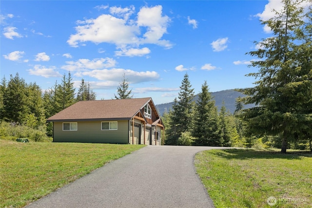 1751 Stone Ridge Dr, Cle Elum, WA 98922 - view of front of house with a front yard and asphalt driveway