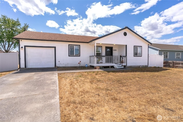 1123 Mather Dr, Moses Lake, WA 98837 - single story home featuring a porch, an attached garage, and driveway