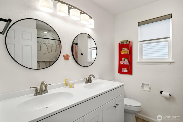 1123 Mather Dr, Moses Lake, WA 98837 - full bath featuring double vanity, a shower, toilet, and baseboards