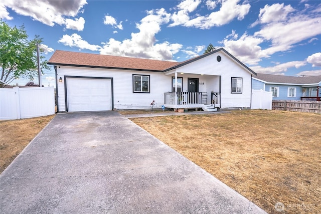 1123 Mather Dr, Moses Lake, WA 98837 - ranch-style house with a garage, covered porch, and driveway