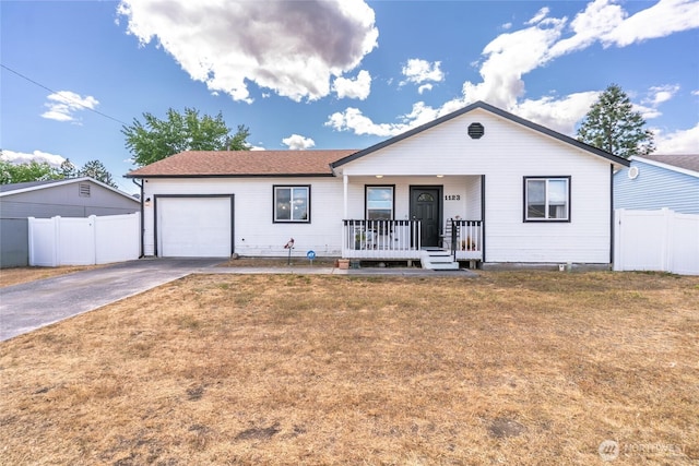 1123 Mather Dr, Moses Lake, WA 98837 - view of front of property featuring a porch, an attached garage, and concrete driveway
