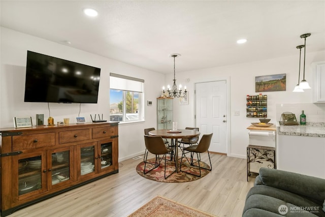 1123 Mather Dr, Moses Lake, WA 98837 - dining space with light wood-style flooring, a chandelier, baseboards, and recessed lighting