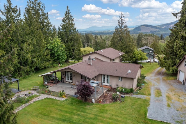 21410 161st Ave E, Graham, WA 98338 - view of subject property with a mountain backdrop and a heavily wooded area