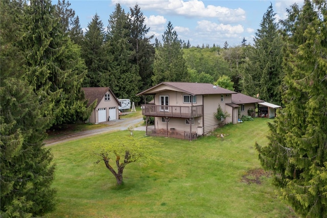 21410 161st Ave E, Graham, WA 98338 - back of property with an outdoor structure, a garage, a wooden deck, a yard, and a wooded view