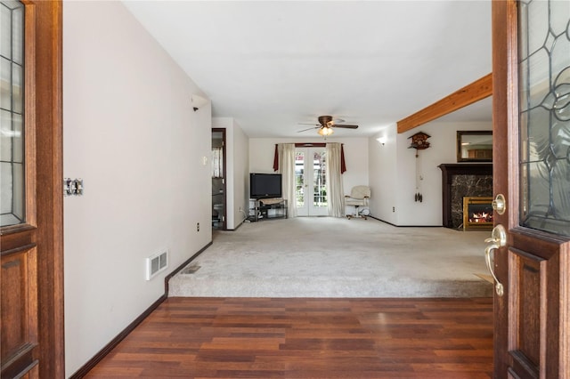 21410 161st Ave E, Graham, WA 98338 - unfurnished living room with french doors, a fireplace, ceiling fan, carpet floors, and baseboards