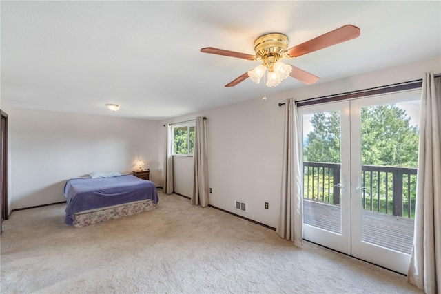 21410 161st Ave E, Graham, WA 98338 - bedroom with access to outside, light carpet, a ceiling fan, and baseboards