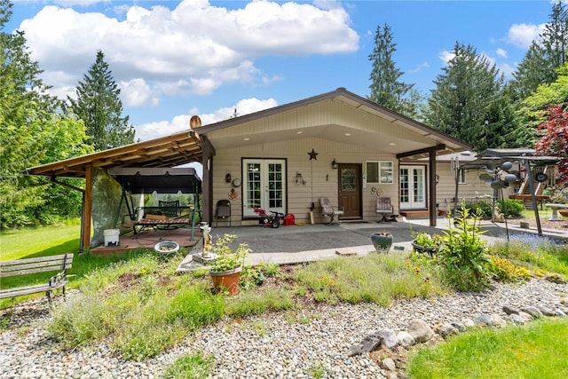 21410 161st Ave E, Graham, WA 98338 - rear view of house featuring french doors and a patio