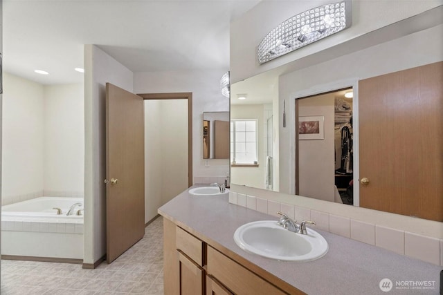 17943 Clear Lake Blvd SE, Yelm, WA 98597 - full bath with double vanity, a garden tub, and a spacious closet