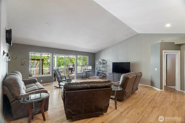 17943 Clear Lake Blvd SE, Yelm, WA 98597 - living area with lofted ceiling, light wood-style flooring, and baseboards