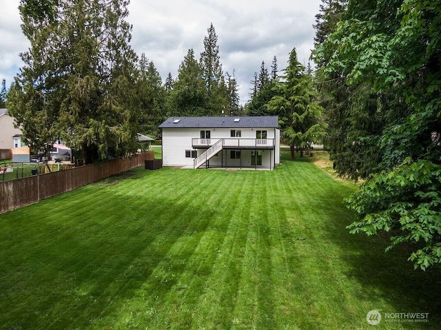 8302 319th St NW, Stanwood, WA 98292 - back of property featuring stairs and a deck