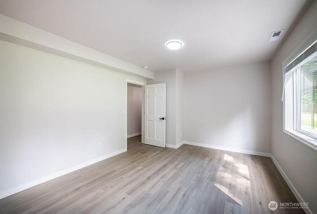 8302 319th St NW, Stanwood, WA 98292 - empty room featuring wood finished floors and baseboards