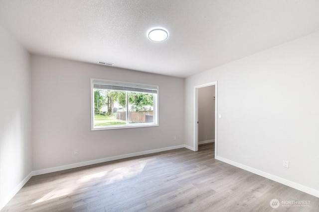 8302 319th St NW, Stanwood, WA 98292 - spare room with wood finished floors and baseboards