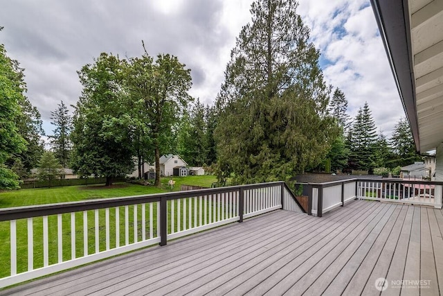 8302 319th St NW, Stanwood, WA 98292 - wooden deck with a lawn and view of wooded area
