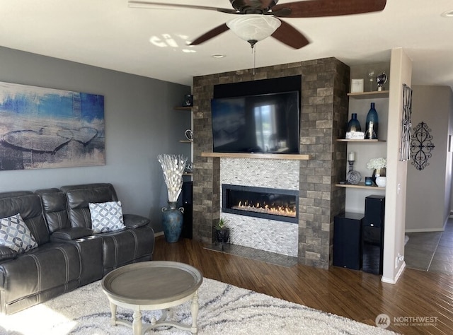 1809 Briarwood Pl, Wenatchee, WA 98802 - living area featuring ceiling fan, a large fireplace, wood finished floors, and baseboards