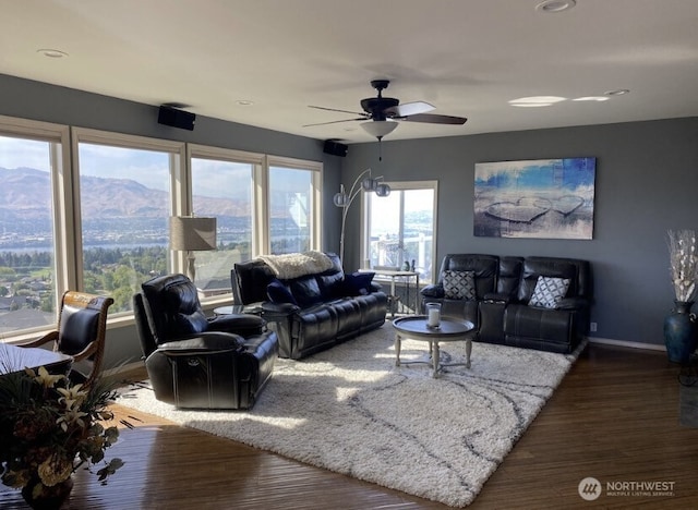 1809 Briarwood Pl, Wenatchee, WA 98802 - living room featuring wood finished floors, ceiling fan, baseboards, and a mountain view