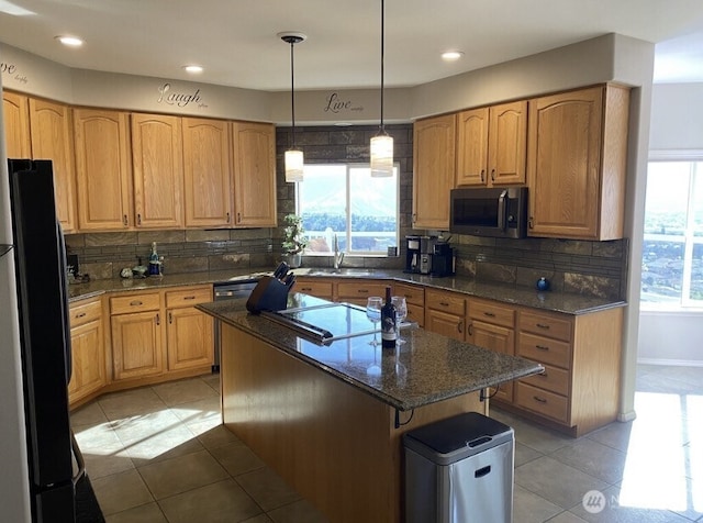 1809 Briarwood Pl, Wenatchee, WA 98802 - kitchen with stainless steel microwave, freestanding refrigerator, plenty of natural light, a center island, and recessed lighting
