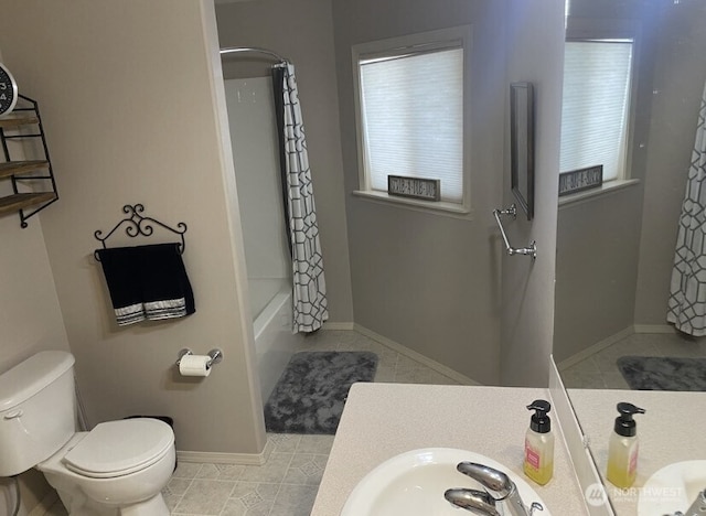 1809 Briarwood Pl, Wenatchee, WA 98802 - bathroom with toilet, vanity, shower / tub combo with curtain, tile patterned flooring, and baseboards