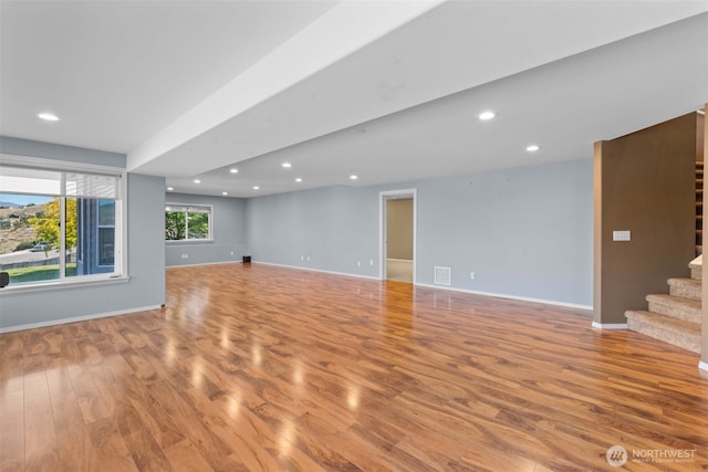 1809 Briarwood Pl, Wenatchee, WA 98802 - unfurnished living room featuring wood finished floors, stairs, baseboards, and recessed lighting