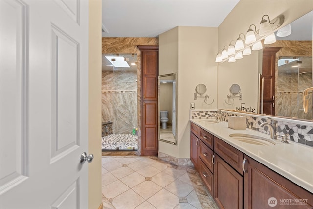 1809 Briarwood Pl, Wenatchee, WA 98802 - full bath featuring double vanity, a stall shower, tile patterned flooring, and tasteful backsplash