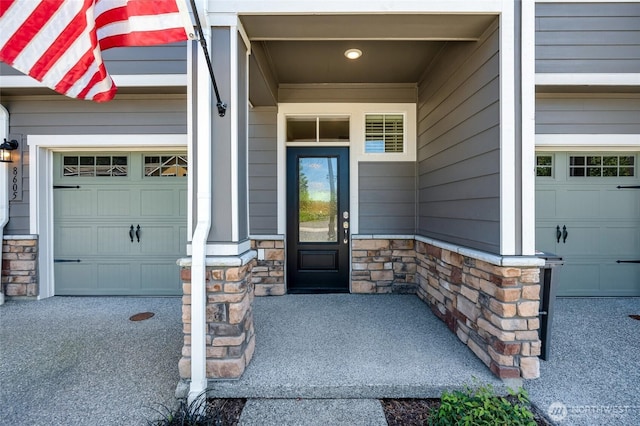 8605 E Gilman Ave, Arlington, WA 98223 - doorway to property featuring stone siding and a garage