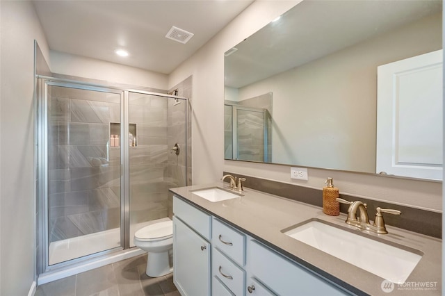 8605 E Gilman Ave, Arlington, WA 98223 - full bath featuring double vanity, a shower stall, tile patterned flooring, and recessed lighting