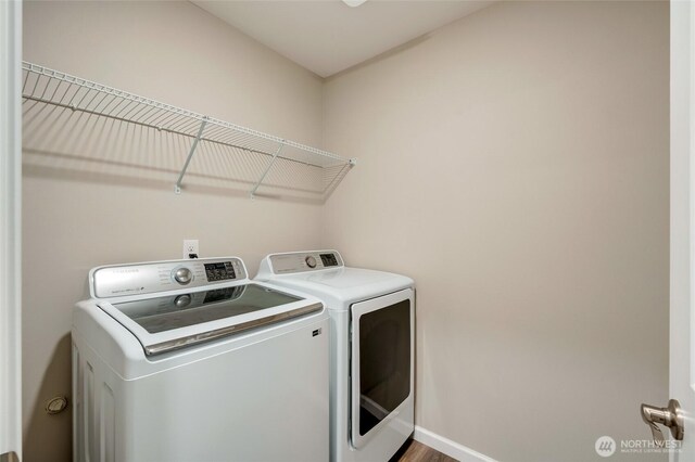 8605 E Gilman Ave, Arlington, WA 98223 - laundry area with washing machine and dryer and wood finished floors