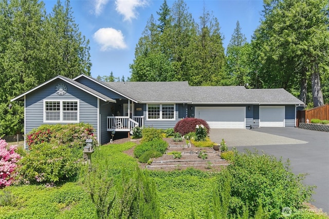 9264 Horizon Ln SE, Port Orchard, WA 98367 - single story home featuring an attached garage, asphalt driveway, a garden, and a shingled roof