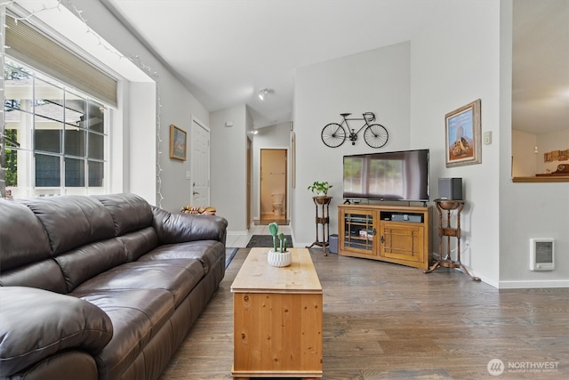 9264 Horizon Ln SE, Port Orchard, WA 98367 - living room featuring wood finished floors, heating unit, baseboards, and vaulted ceiling