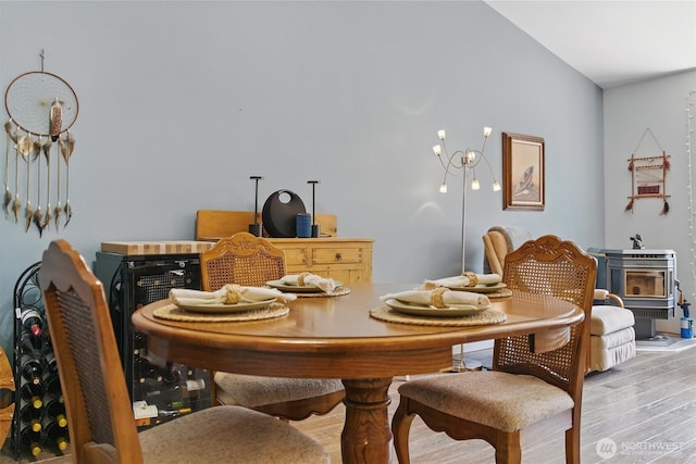 9264 Horizon Ln SE, Port Orchard, WA 98367 - dining area with light wood-style flooring and a wood stove