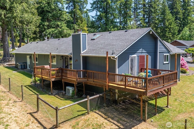 9264 Horizon Ln SE, Port Orchard, WA 98367 - back of house featuring a wooden deck, a chimney, a shingled roof, and central AC