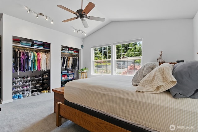 9264 Horizon Ln SE, Port Orchard, WA 98367 - carpeted bedroom featuring multiple closets, vaulted ceiling, and a ceiling fan