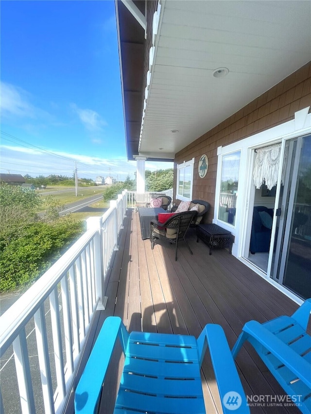 208 Taurus Blvd SW, Ocean Shores, WA 98569 - wooden deck with outdoor lounge area