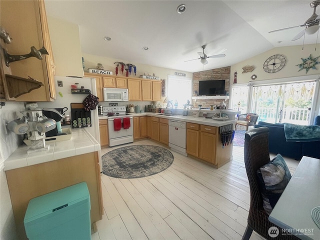 208 Taurus Blvd SW, Ocean Shores, WA 98569 - kitchen featuring white appliances, a ceiling fan, open floor plan, tile countertops, and vaulted ceiling