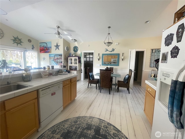 208 Taurus Blvd SW, Ocean Shores, WA 98569 - kitchen with white appliances, tile countertops, ceiling fan, a sink, and lofted ceiling