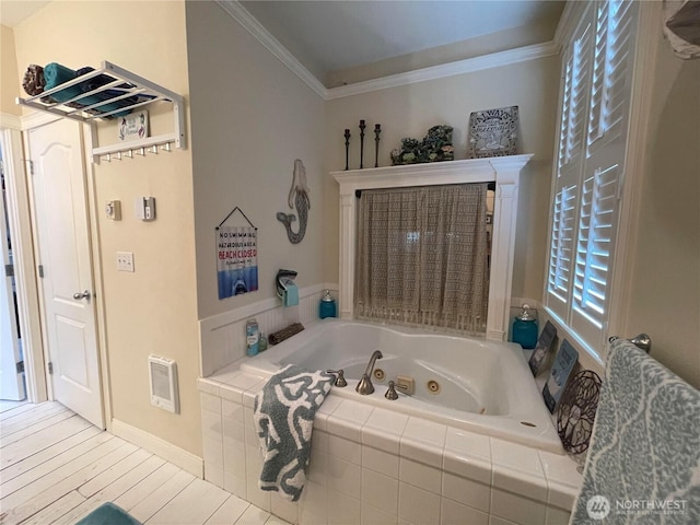 208 Taurus Blvd SW, Ocean Shores, WA 98569 - bathroom with a whirlpool tub, ornamental molding, wood finished floors, heating unit, and baseboards