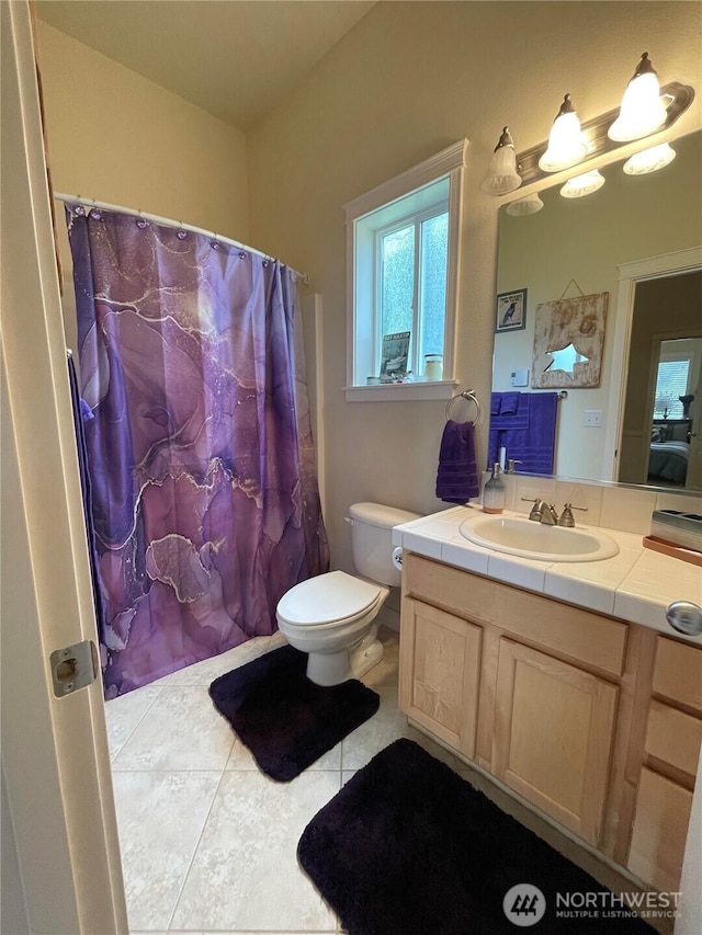 208 Taurus Blvd SW, Ocean Shores, WA 98569 - bathroom with tile patterned flooring, vanity, and toilet