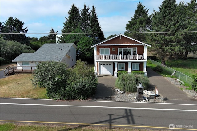 208 Taurus Blvd SW, Ocean Shores, WA 98569 - view of front of house with asphalt driveway and a garage