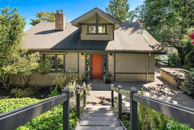 14830 Glen Acres Rd SW, Vashon, WA 98070 - view of front facade featuring roof with shingles and a chimney