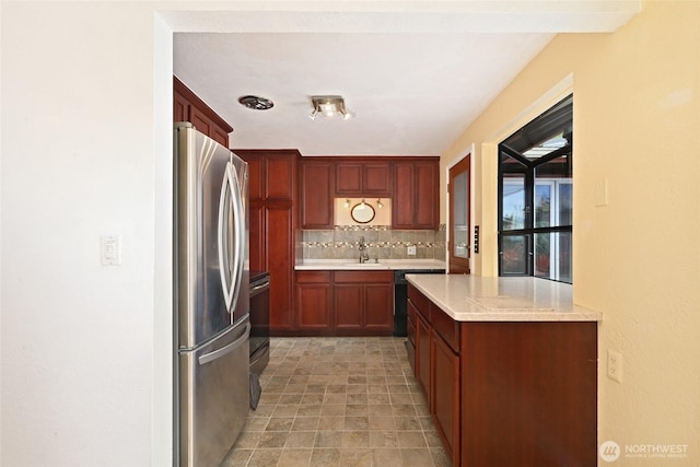 4245 Williams Ave W, Seattle, WA 98199 - kitchen with freestanding refrigerator, a sink, light countertops, decorative backsplash, and dishwasher