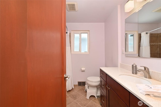 4245 Williams Ave W, Seattle, WA 98199 - bathroom with vanity, tile patterned flooring, toilet, and a shower with curtain