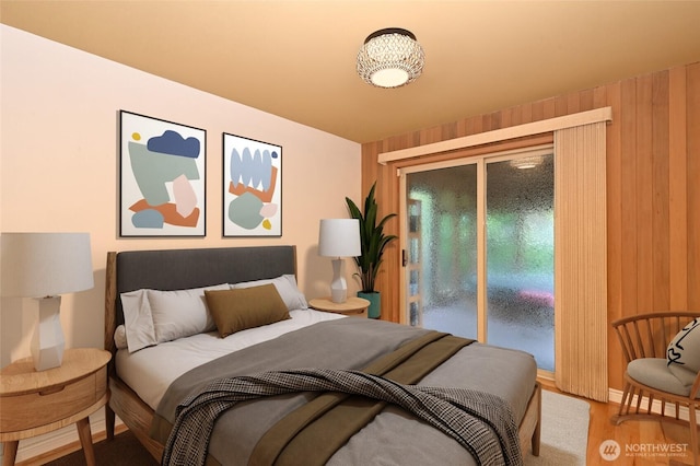 4245 Williams Ave W, Seattle, WA 98199 - bedroom featuring access to exterior, wood finished floors, and wooden walls