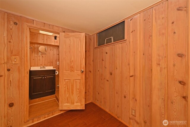 4245 Williams Ave W, Seattle, WA 98199 - interior space with dark wood-type flooring, wooden walls, and a sink