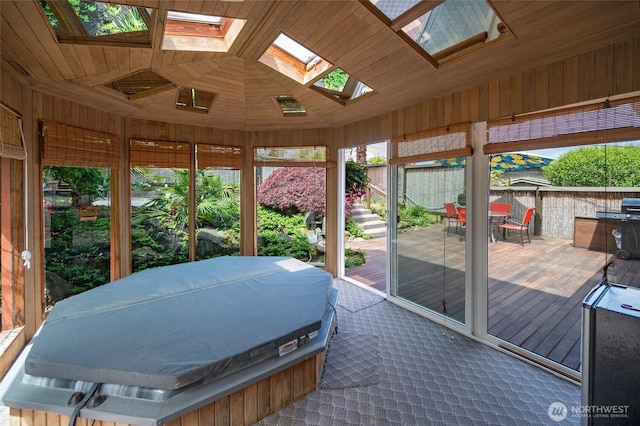 4245 Williams Ave W, Seattle, WA 98199 - sunroom with outdoor dining space, a skylight, and a jacuzzi